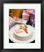 Framed High angle view of a birthday cake with gifts