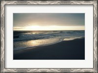 Framed Waves breaking on the beach at sunrise