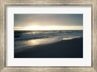 Framed Waves breaking on the beach at sunrise