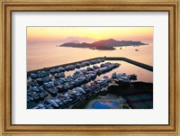 Framed Sunrise over Peng Chau Island with Discovery Bay Marina in foreground, Hong Kong, China