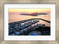 Framed Sunrise over Peng Chau Island with Discovery Bay Marina in foreground, Hong Kong, China