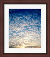 Framed Low angle view of sunrise seen through clouds