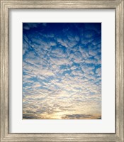 Framed Low angle view of sunrise seen through clouds