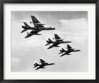Framed Low angle view of four fighter planes flying in formation, F-100 Super Sabre