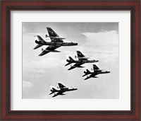 Framed Low angle view of four fighter planes flying in formation, F-100 Super Sabre