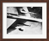 Framed Low angle view of a bomber plane carrying missiles during fight, AGM-28 Hound Dog, B-52 Stratofortress
