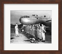 Framed Group of army soldiers standing in a row near a fighter plane, B-29 Superfortress