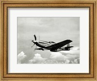 Framed Low angle view of a military airplane in flight, F-51 Mustang