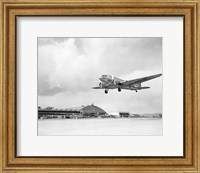 Framed Low angle view of a military airplane landing, Douglas DC-3