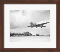 Framed Low angle view of a military airplane landing, Douglas DC-3