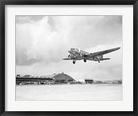 Framed Low angle view of a military airplane landing, Douglas DC-3