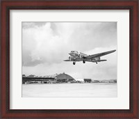 Framed Low angle view of a military airplane landing, Douglas DC-3