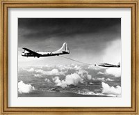 Framed Side profile of a military tanker airplane refueling in flight, B-29 Superfortress, F-84 Thunderjet