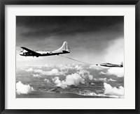 Framed Side profile of a military tanker airplane refueling in flight, B-29 Superfortress, F-84 Thunderjet