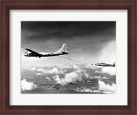 Framed Side profile of a military tanker airplane refueling in flight, B-29 Superfortress, F-84 Thunderjet