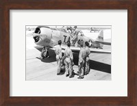 Framed Rear view of four soldiers standing near a fighter plane, T-6 Texan