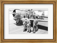 Framed Rear view of four soldiers standing near a fighter plane, T-6 Texan
