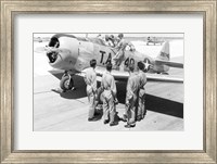 Framed Rear view of four soldiers standing near a fighter plane, T-6 Texan