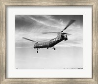 Framed Low angle view of a military helicopter in flight, H-21D Helicopter, US Military