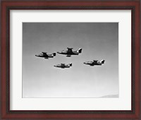 Framed Low angle view of four fighter planes flying in formation, F9F Panther