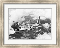 Framed High angle view of a military airplane in flight, C-130 Hercules