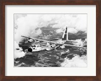Framed High angle view of a military airplane in flight, C-130 Hercules