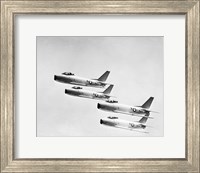 Framed Four military planes flying in a formation