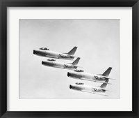 Framed Four military planes flying in a formation