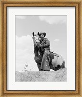 Framed Cowboy on top of escarpment