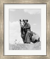 Framed Cowboy on top of escarpment