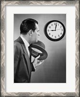 Framed Businessman looking at clock