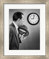 Framed Businessman looking at clock