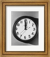 Framed Close-up of a wall clock hanging on a wall