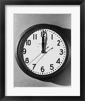 Framed Close-up of a wall clock hanging on a wall