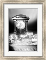 Framed Clock showing 12 o'clock with champagne flutes and party hats in the foreground