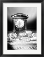 Framed Clock showing 12 o'clock with champagne flutes and party hats in the foreground