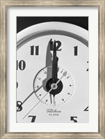 Framed Face clock showing 12 o'clock, close-up