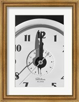 Framed Face clock showing 12 o'clock, close-up