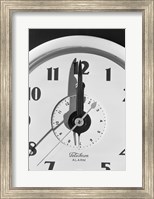 Framed Face clock showing 12 o'clock, close-up