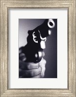 Framed Close-up of a person holding a handgun