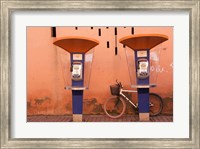 Framed Public telephone booths in front of a wall, Morocco