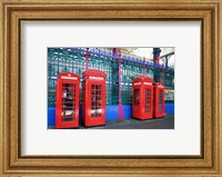 Framed Four telephone booths near a grille, London, England