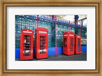 Framed Four telephone booths near a grille, London, England