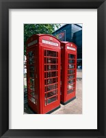 Framed Two telephone booths, London, England
