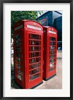 Framed Two telephone booths, London, England