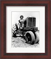 Framed Farmer Sitting on a Tractor in a Field