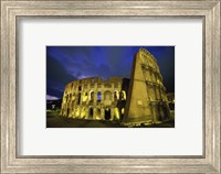 Framed Colosseum lit up at night, Rome, Italy