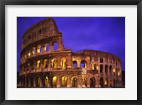 Framed Low angle view of a coliseum lit up at night, Colosseum, Rome, Italy