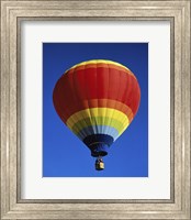 Framed Low angle view of a hot air balloon rising, Albuquerque International Balloon Fiesta, Albuquerque, New Mexico, USA