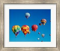 Framed Low angle view of a group of hot air balloons in the sky